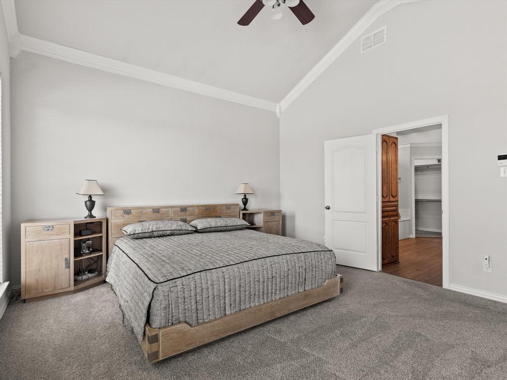 10066 Irish Ridge Forney, TX 75126 - Photo 10 of 39 Bedroom with carpet flooring, crown molding, high vaulted ceiling, a spacious closet, and ceiling fan