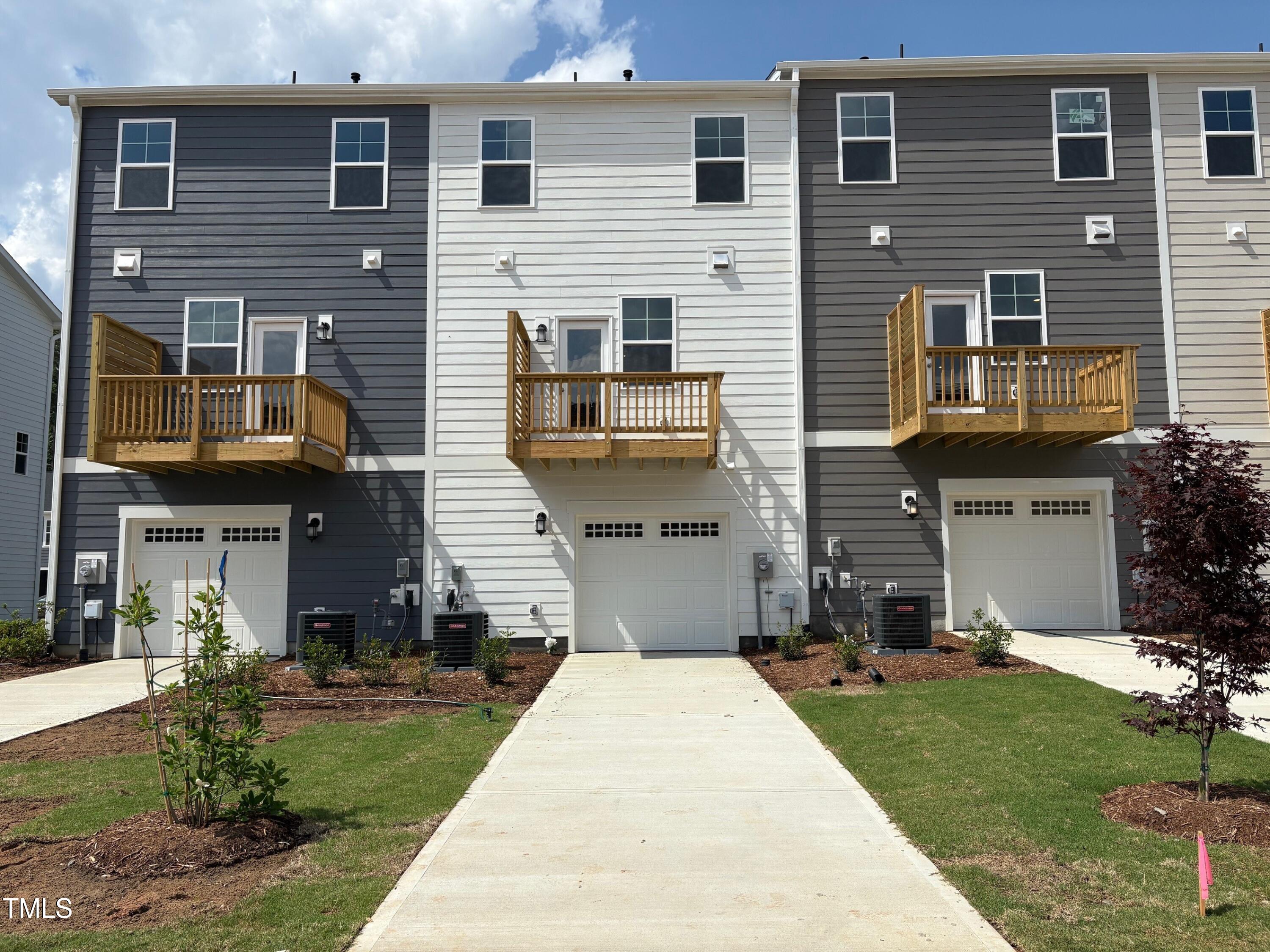 331 Deercroft Drive Apex, NC 27539 - Photo 8 of 21 a front view of a house with a yard and a garage