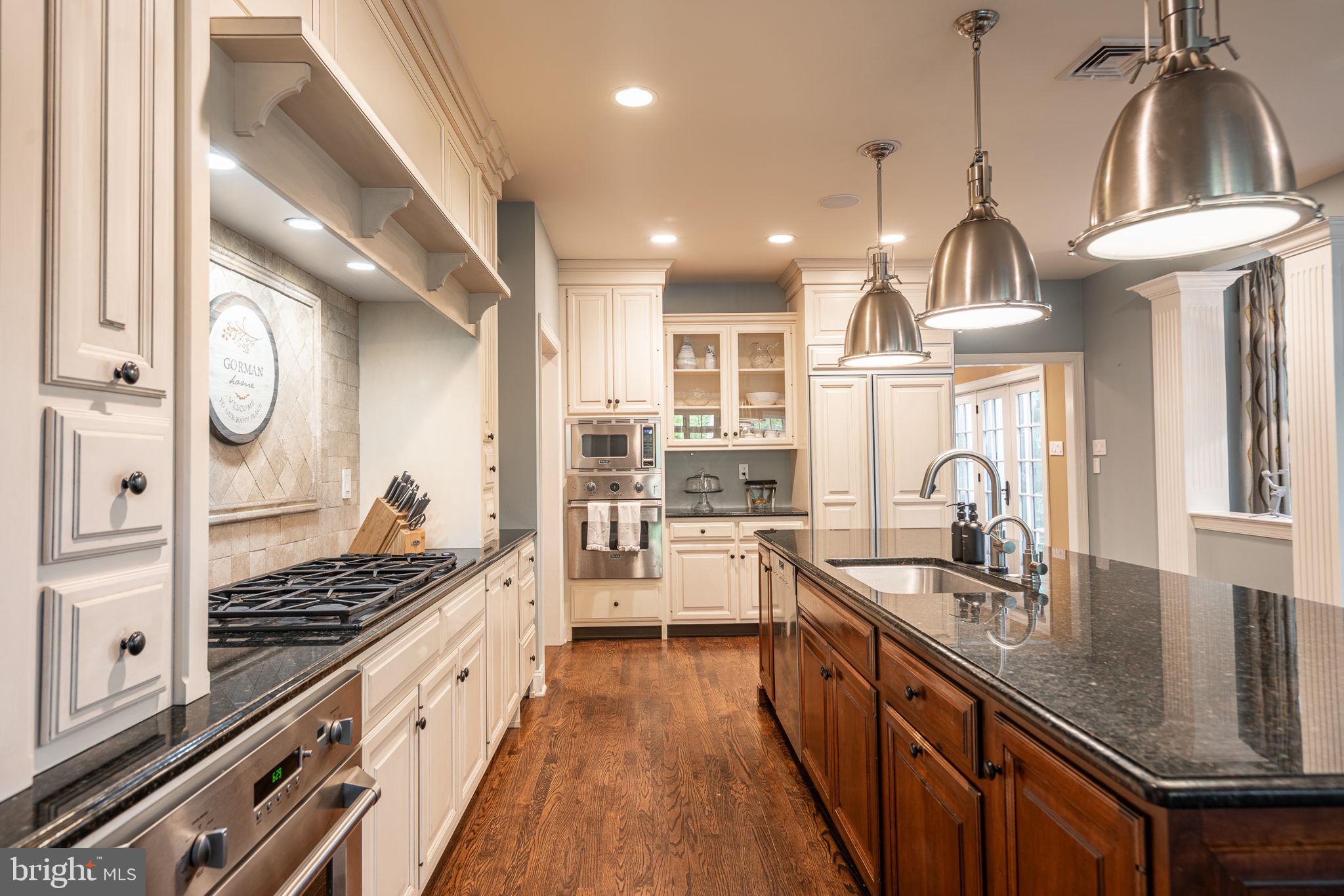 4104 Howell Road Malvern, PA 19355 - Photo 21 of 84 a kitchen with counter top space appliances and cabinets
