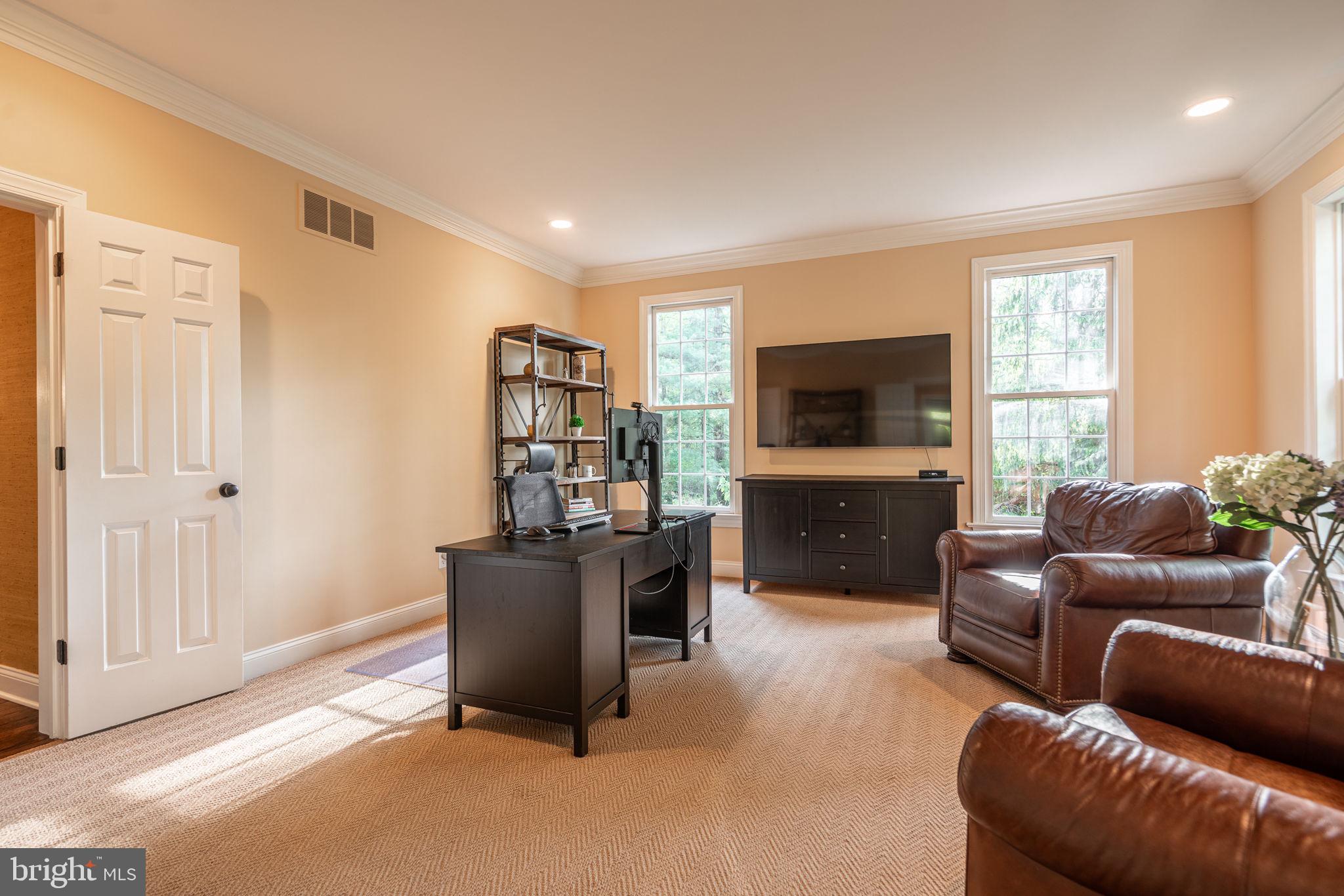 4104 Howell Road Malvern, PA 19355 - Photo 30 of 84 a living room with furniture and a flat screen tv