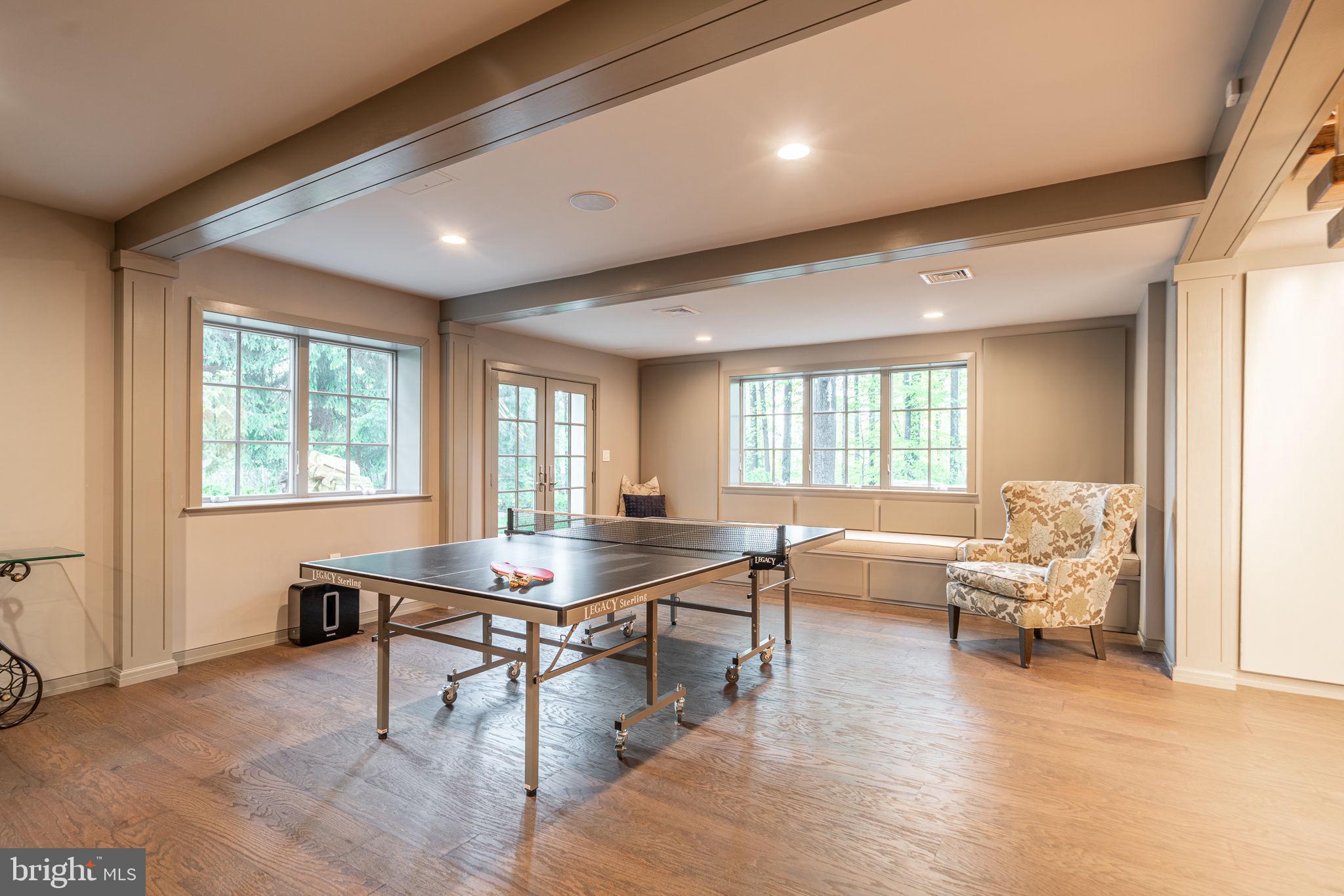 4104 Howell Road Malvern, PA 19355 - Photo 43 of 84 a living room with furniture a wooden floor and a large window