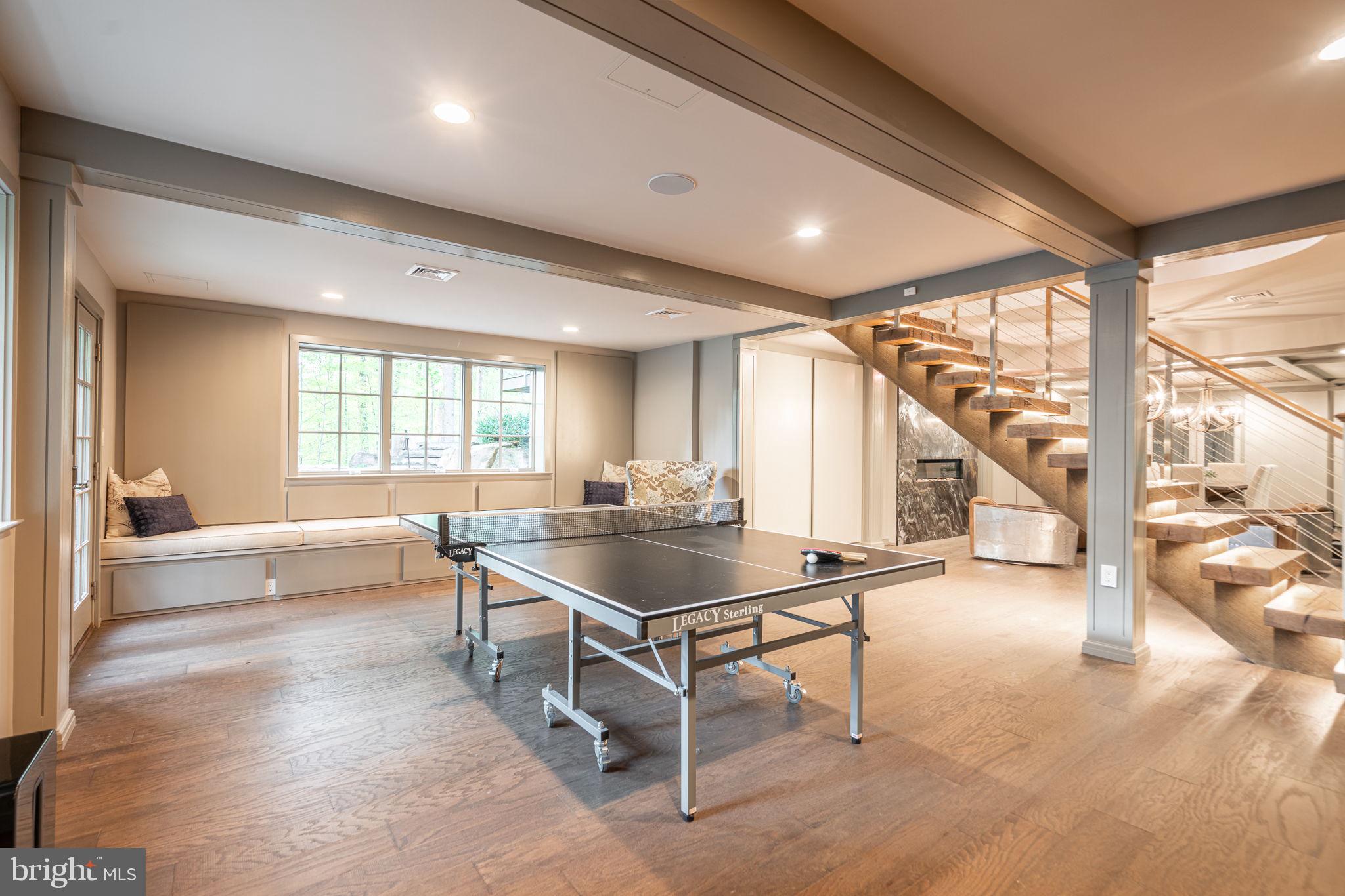 4104 Howell Road Malvern, PA 19355 - Photo 44 of 84 a living room with table a table and chairs next to a large window