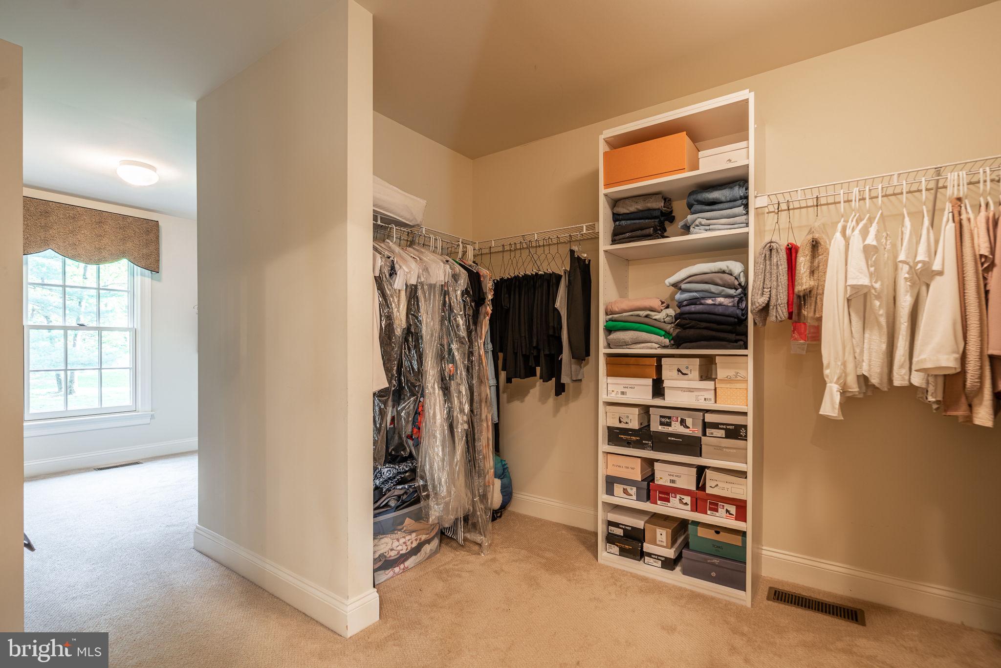 4104 Howell Road Malvern, PA 19355 - Photo 55 of 84 a view of walk in closet with clothes and shoes
