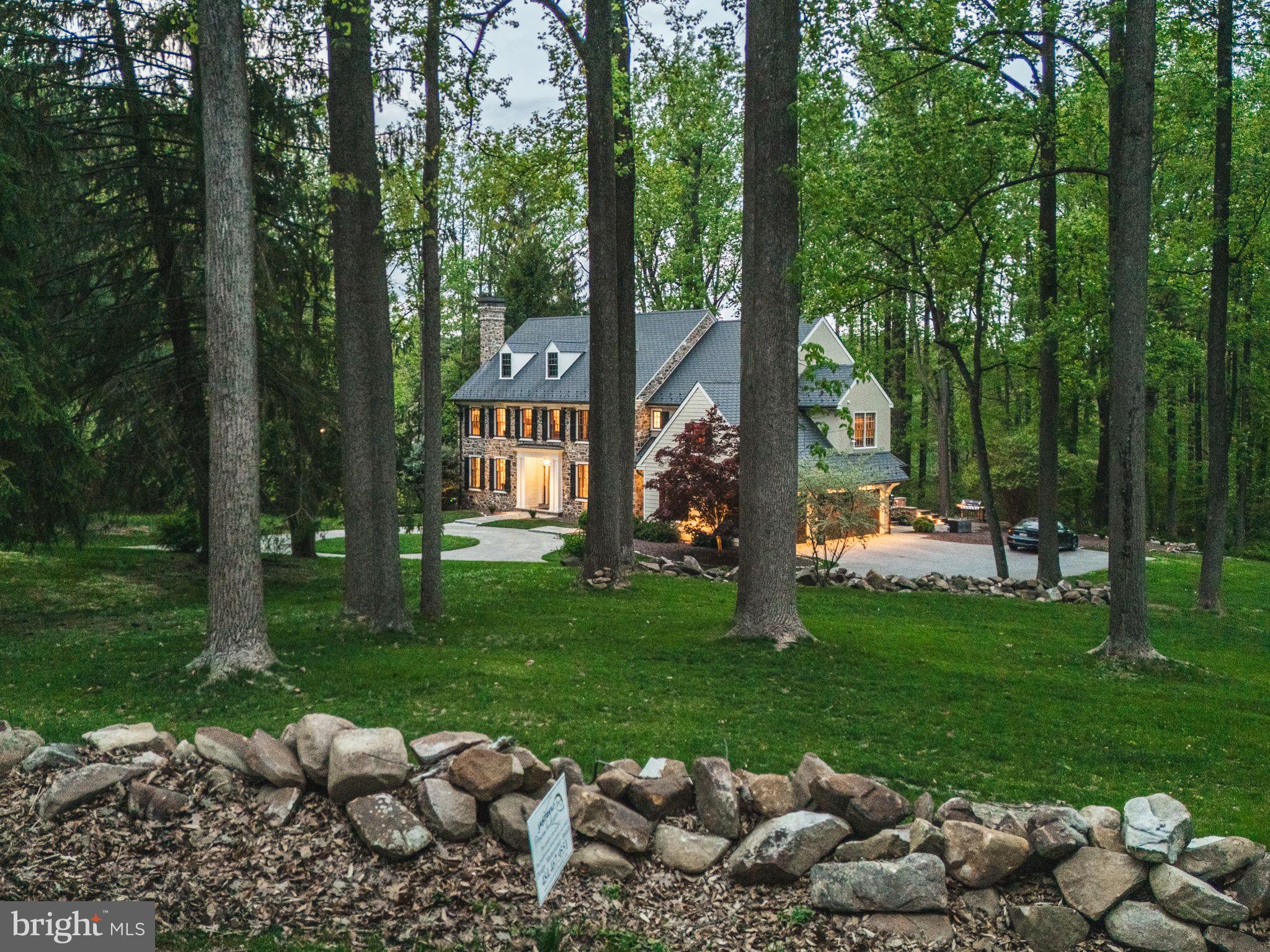 4104 Howell Road Malvern, PA 19355 - Photo 7 of 84 a view of a garden with plants and large trees