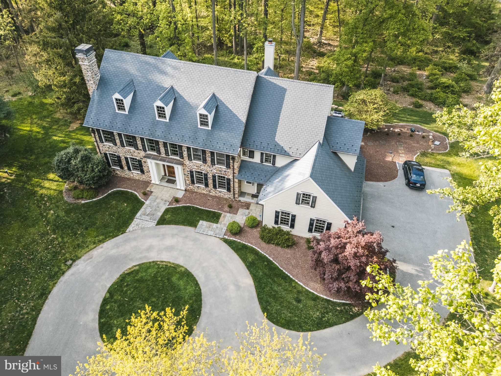 4104 Howell Road Malvern, PA 19355 - Photo 74 of 84 an aerial view of a house with a yard and a garden