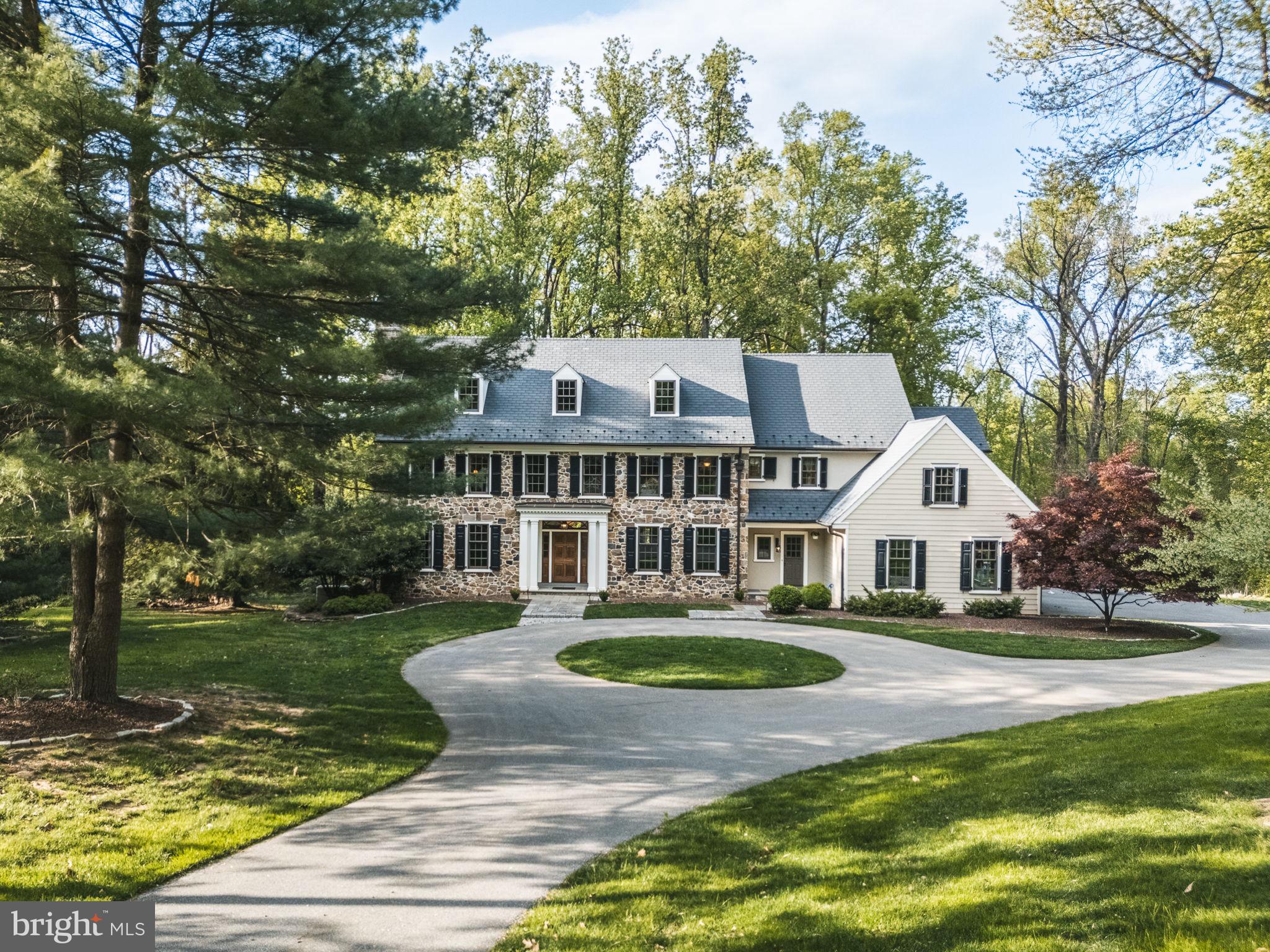4104 Howell Road Malvern, PA 19355 - Photo 83 of 84 a front view of a house with a yard table and chairs