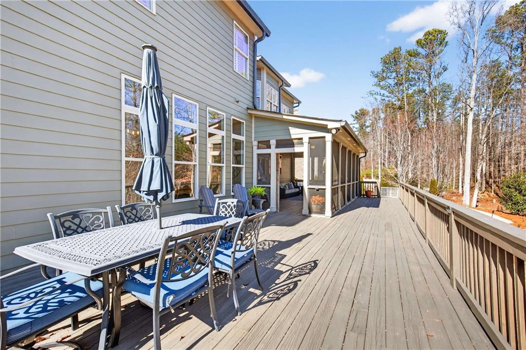 340 Scott Farm Drive Powder Springs, GA 30127 - Photo 47 of 59 a view of a patio with table and chairs with wooden floor and fence