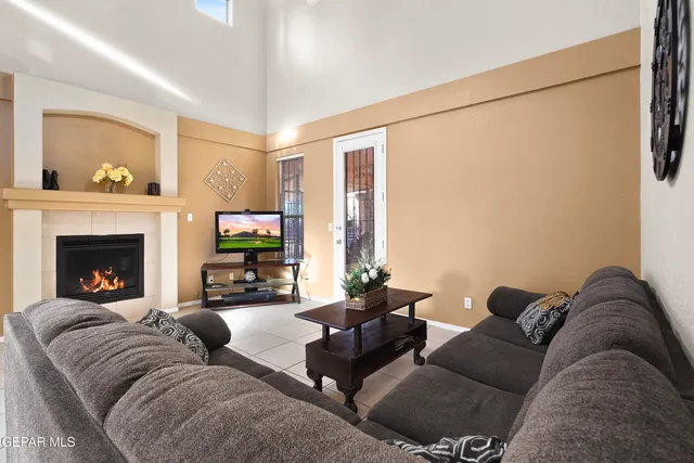 a living room with furniture and a fireplace
