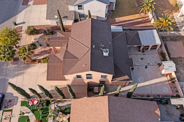 an aerial view of residential building and ocean view