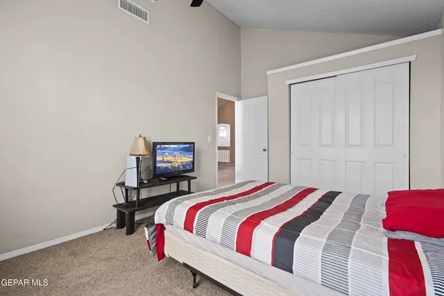 a bedroom with a bed and a chair