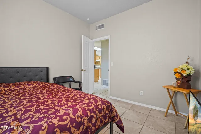 a view of a room with window and a potted plant