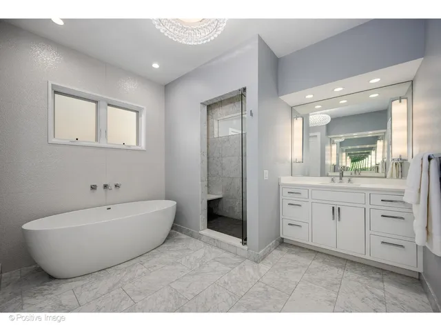 a bedroom with a bed and a night stand