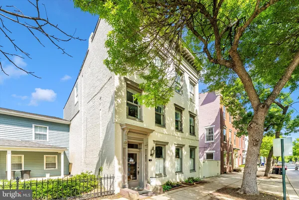 a view of a building with a tree