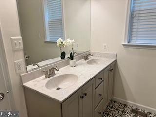 7792 Old Receiver Road Frederick, MD 21702 - Photo 14 of 51 a bathroom with a sink and a mirror