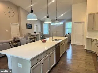 a large kitchen with a table and chairs