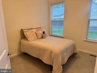 7792 Old Receiver Road Frederick, MD 21702 - Photo 21 of 51 a bed sitting in a bedroom next to a window