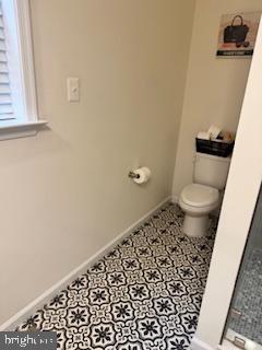 7792 Old Receiver Road Frederick, MD 21702 - Photo 22 of 51 a bathroom with a toilet and a window