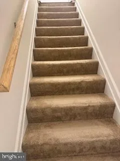 a bathroom with a tub and a window