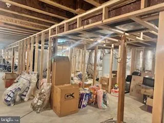 a view of a storage room with water heater and windows