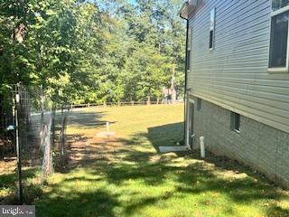 7792 Old Receiver Road Frederick, MD 21702 - Photo 39 of 51 a backyard of a house with a yard and outdoor seating