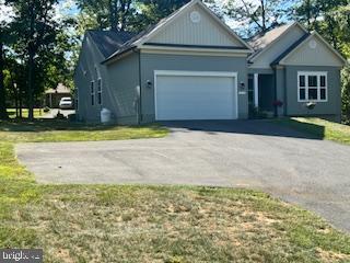 7792 Old Receiver Road Frederick, MD 21702 - Photo 48 of 51 a front view of a house with a yard and garage