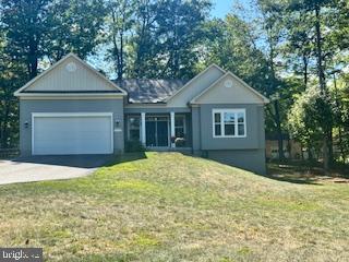 7792 Old Receiver Road Frederick, MD 21702 - Photo 50 of 51 a front view of a house with a yard and garage