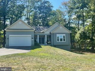 7792 Old Receiver Road Frederick, MD 21702 - Photo 51 of 51 a front view of a house with a yard and garage