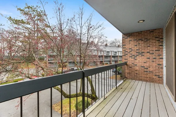 a view of balcony with wooden floor
