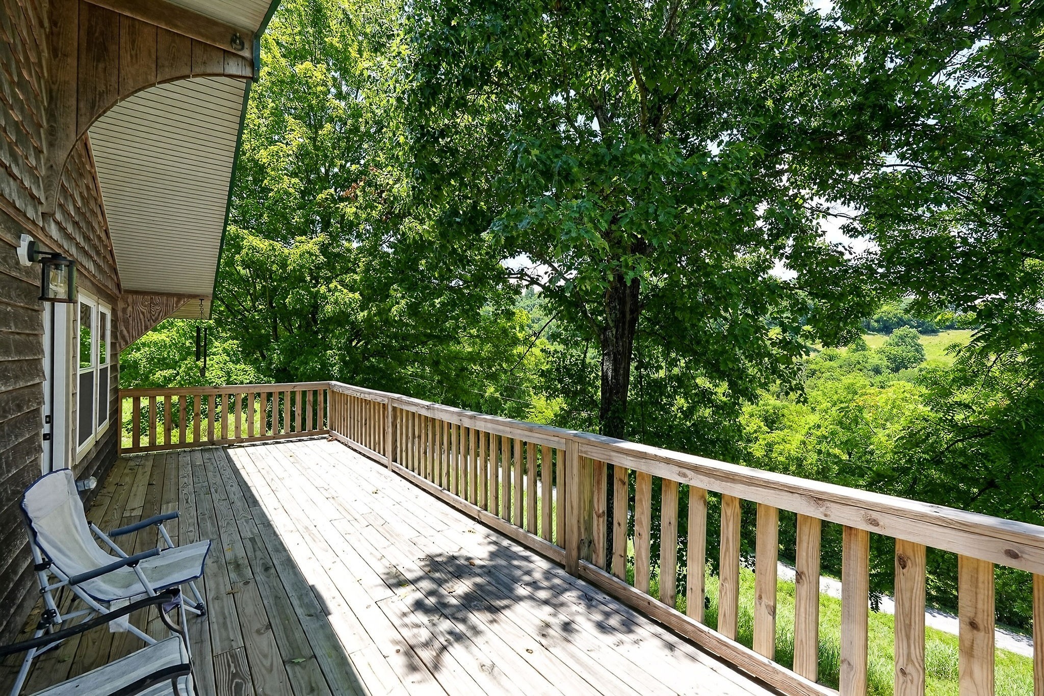 99 Judkins Road Hickman, TN 38567 - Photo 20 of 62 a view of balcony with wooden floor and outdoor space