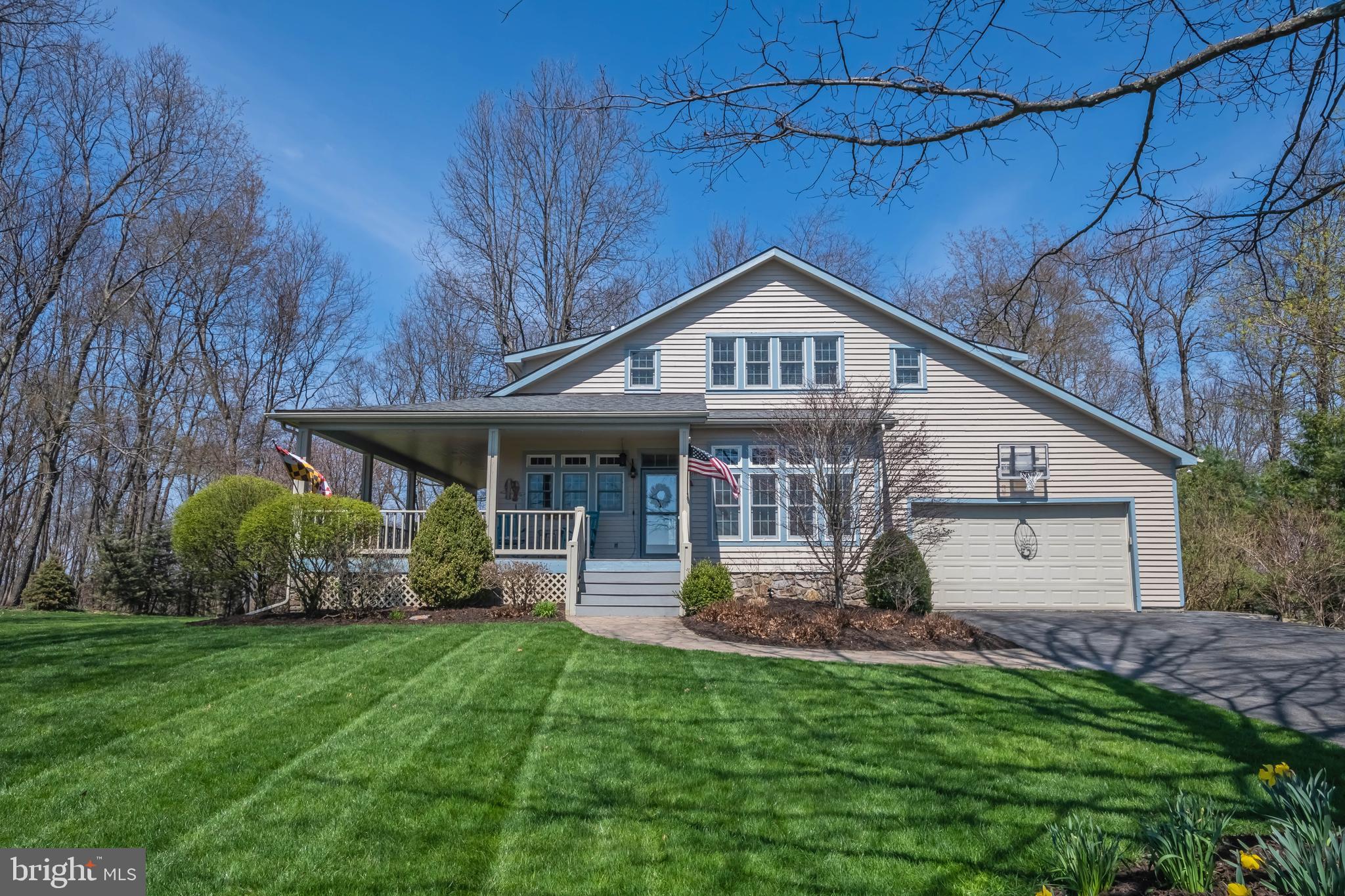 726 Sunset Ridge Drive McHenry, MD 21541 - Photo 1 of 50 a front view of a house with a yard and trees