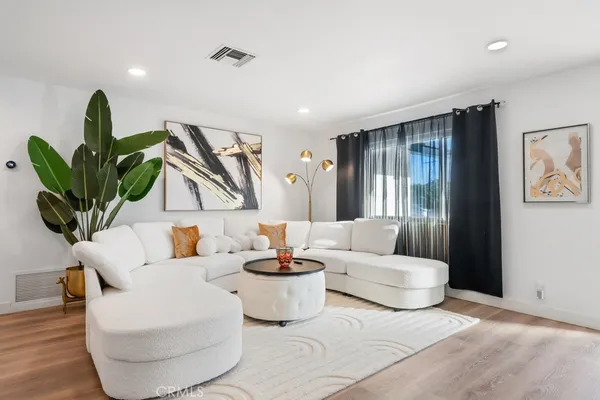 a living room with furniture and a coffee table