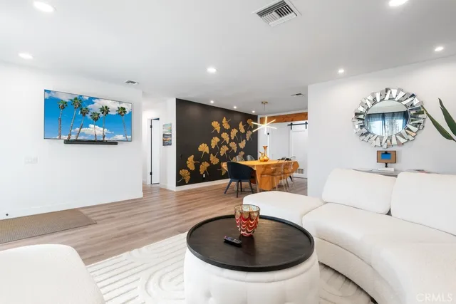 a living room with furniture and a coffee table