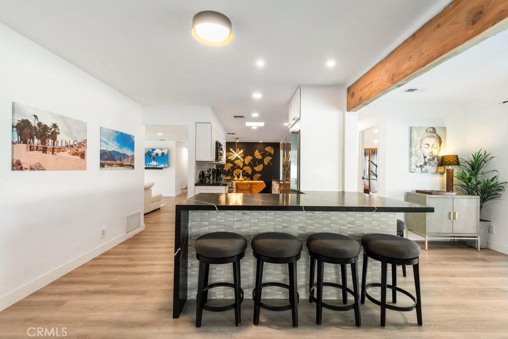 1980 East Rochelle Road Palm Springs, CA 92262 - Photo 15 of 60 a large kitchen with a table and chairs