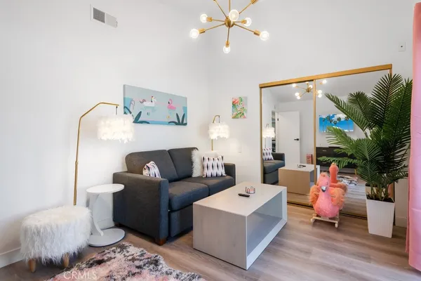 a bedroom with a bed and a couch