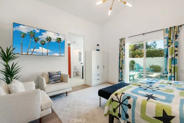 a bedroom with a bed and a couch