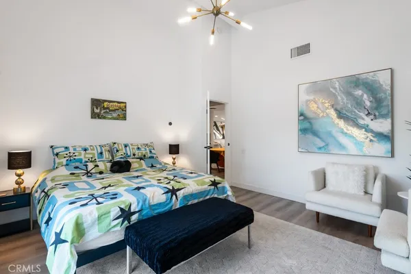 a bathroom with a granite countertop sink a toilet and shower