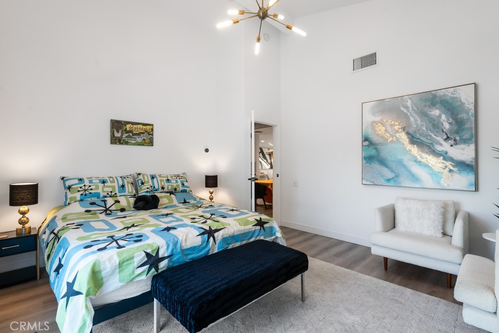 1980 East Rochelle Road Palm Springs, CA 92262 - Photo 23 of 60 a bedroom with a bed and a couch