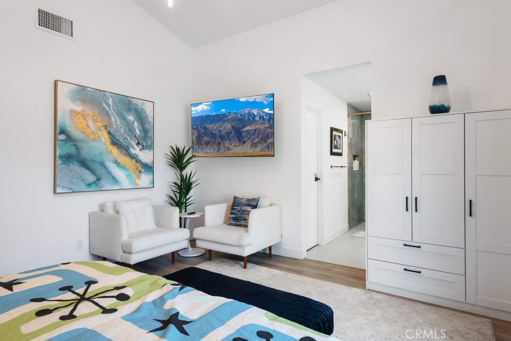 1980 East Rochelle Road Palm Springs, CA 92262 - Photo 24 of 60 a living room with furniture and wooden floor