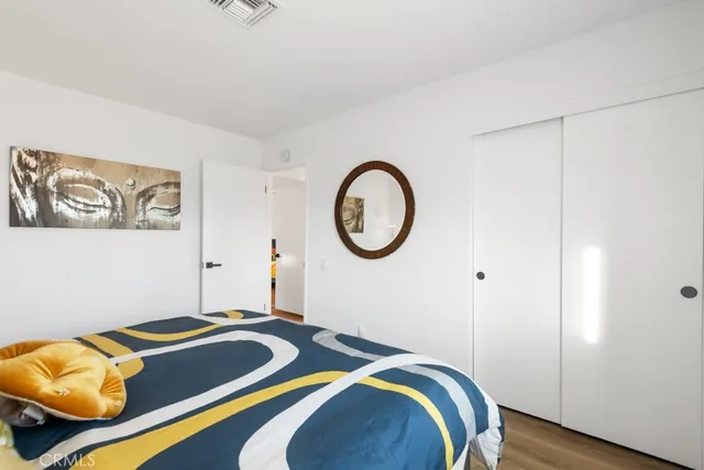 a bathroom with a sink toilet vanity and shower