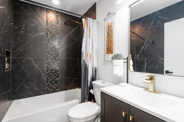 a living room with furniture and flat screen tv