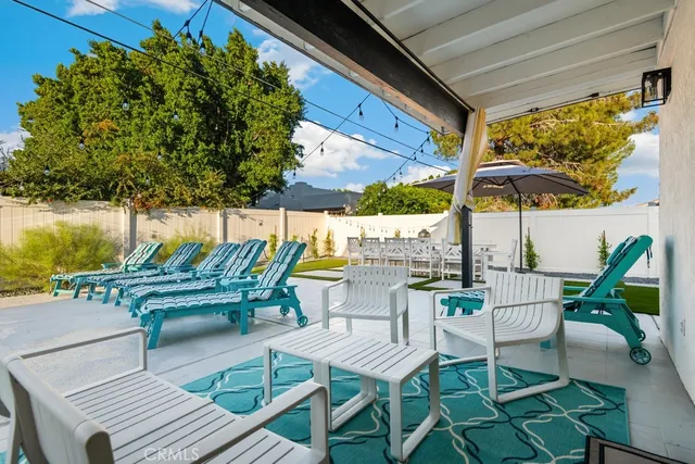 a view of a swimming pool with a patio