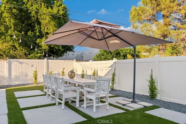 a view of backyard with seating space