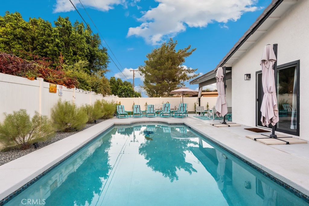 1980 East Rochelle Road Palm Springs, CA 92262 - Photo 42 of 60 a view of a swimming pool with a patio
