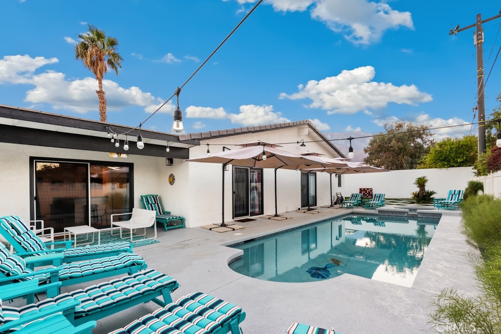 1980 East Rochelle Road Palm Springs, CA 92262 - Photo 46 of 60 a swimming pool with outdoor seating and yard