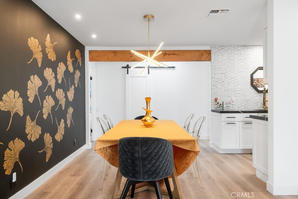 1980 East Rochelle Road Palm Springs, CA 92262 - Photo 8 of 60 a bedroom with a bed and a chandelier