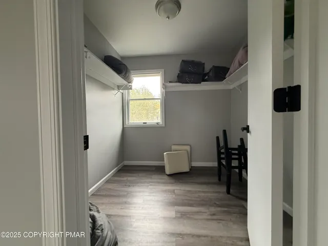 a view of room with furniture and a window