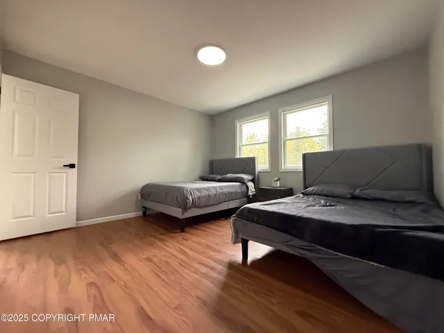 a bedroom with bed and window