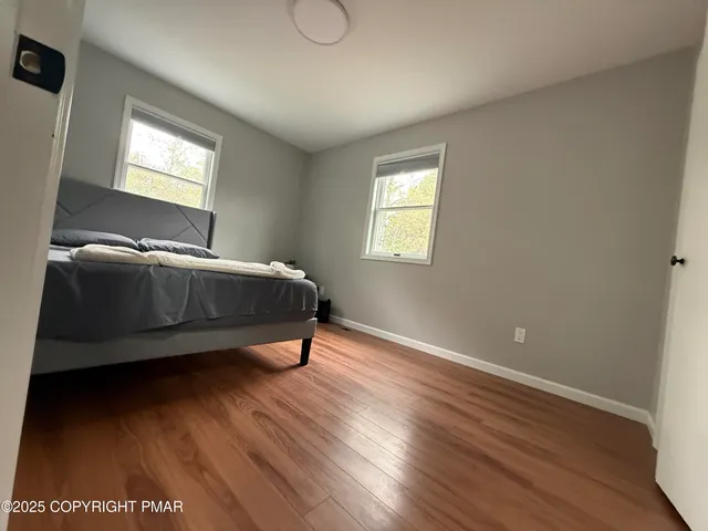 a room with a bed and window