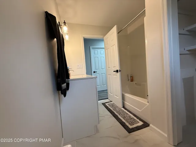 a view of bathroom with a bath tub