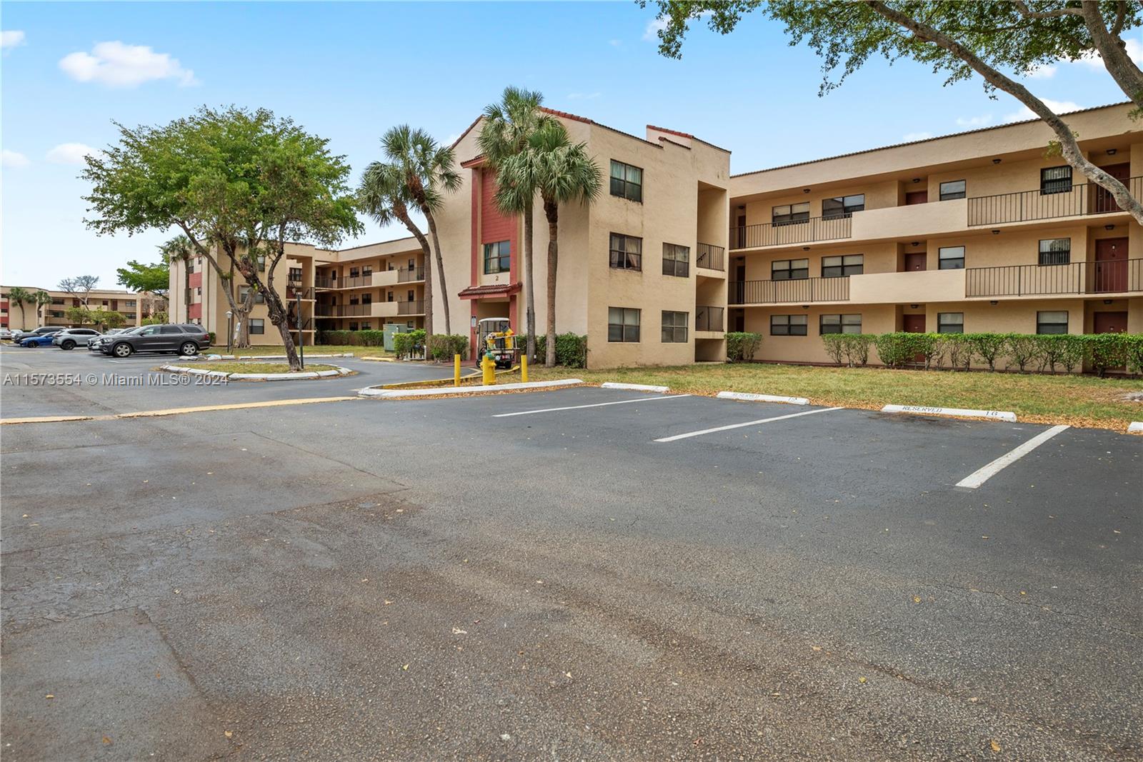 3252 Foxcroft Road, Unit 216 Miramar, FL 33025 - Photo 14 of 16 a front view of residential building with street view